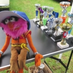 Club mascot protecting the trophies